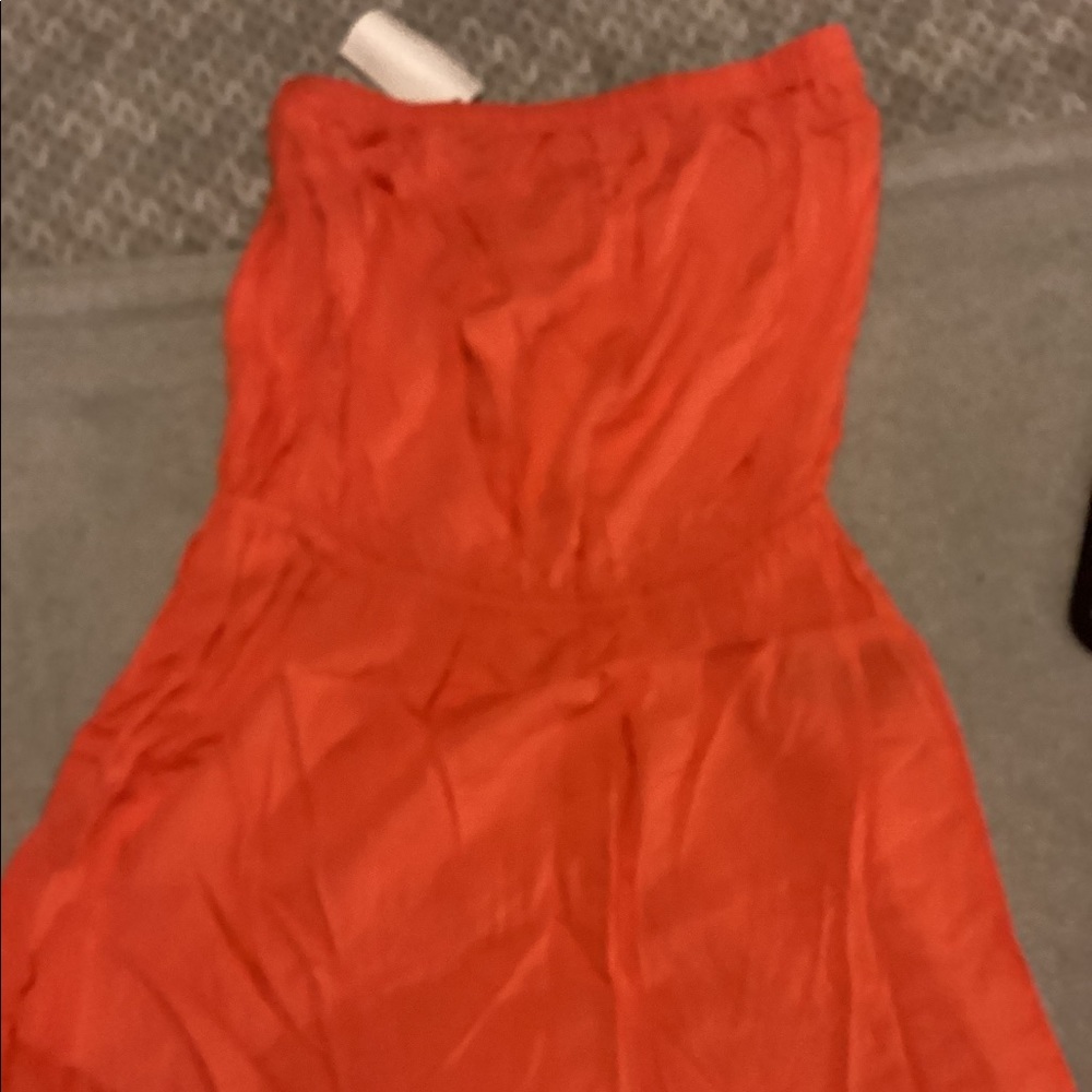 Orange sleeveless romper size 10. Brand new tags still attached